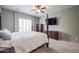 Spacious bedroom featuring neutral paint, a ceiling fan, and plush carpeted floors at 2320 E Allen St, Phoenix, AZ 85042