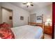 Traditional bedroom featuring wood bed frame, matching dresser, and a ceiling fan at 2320 E Allen St, Phoenix, AZ 85042