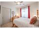 Cozy bedroom featuring a four-poster bed, neutral carpet, and soft lighting at 2320 E Allen St, Phoenix, AZ 85042