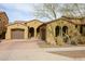 Charming single-story home with a terracotta tile roof, dual garages, and well maintained landscaping at 2320 E Allen St, Phoenix, AZ 85042