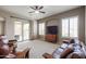 Inviting living room with plush seating, ceiling fan, and sliding doors to the outdoor patio at 2320 E Allen St, Phoenix, AZ 85042