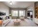 Bright living room featuring large windows, stylish furniture, and a smooth flow at 2320 E Allen St, Phoenix, AZ 85042