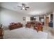 Bright living room with a ceiling fan, open to the kitchen and dining area at 2320 E Allen St, Phoenix, AZ 85042