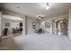 Spacious room featuring archways, neutral decor, and seamless flow to dining area at 2320 E Allen St, Phoenix, AZ 85042