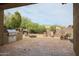 Outdoor kitchen with built-in BBQ, stone pavers, firepit, and relaxing seating area at 2320 E Allen St, Phoenix, AZ 85042