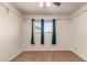 This is a bright bedroom with hardwood floors at 2442 E University Dr # 6, Mesa, AZ 85213
