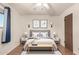 Stylishly furnished bedroom featuring neutral decor, hardwood floors, and a cozy, inviting atmosphere at 2442 E University Dr # 6, Mesa, AZ 85213