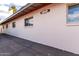 Side view of a light pink home with visible address and multiple windows at 2442 E University Dr # 6, Mesa, AZ 85213