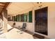 Covered front porch featuring seating area and secure front door entry at 2442 E University Dr # 6, Mesa, AZ 85213