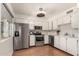 Clean, well-maintained kitchen featuring white cabinetry and stainless steel appliances at 2442 E University Dr # 6, Mesa, AZ 85213