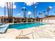 Well-maintained community pool area with lounging chairs and clear blue water at 2442 E University Dr # 6, Mesa, AZ 85213