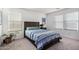 Comfortable bedroom with carpet features a wood bed frame and nightstand at 24531 W Cocopah St, Buckeye, AZ 85326