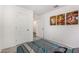 Cozy bedroom featuring bright white walls, carpeted floor and modern art pieces enhancing its aesthetic appeal at 24531 W Cocopah St, Buckeye, AZ 85326