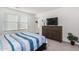 Cozy bedroom boasts natural light, dresser, and stylish decor at 24531 W Cocopah St, Buckeye, AZ 85326
