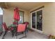 Inviting covered patio with outdoor dining set, offering a relaxing space for entertaining or enjoying the fresh air at 24531 W Cocopah St, Buckeye, AZ 85326