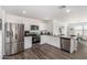 Modern kitchen featuring stainless steel appliances, white cabinets and a stainless steel dishwasher at 24531 W Cocopah St, Buckeye, AZ 85326