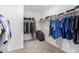 Spacious walk-in closet offers ample storage with rods and shelves for organized clothing and accessories at 24531 W Cocopah St, Buckeye, AZ 85326