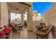 Cozy balcony featuring comfortable seating and views of the community and palm trees at 2511 W Queen Creek Rd # 163, Chandler, AZ 85248