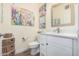 Charming powder room boasts a modern vanity, decorative mirror, and tasteful decor at 2511 W Queen Creek Rd # 163, Chandler, AZ 85248