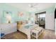 Bedroom features a stylish design, natural light, and a sliding glass door to a balcony at 2511 W Queen Creek Rd # 163, Chandler, AZ 85248