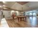 Large game room featuring a pool table, ping pong table, and various seating arrangements at 2511 W Queen Creek Rd # 163, Chandler, AZ 85248