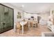 Well-lit kitchen and dining area with stainless appliances, white cabinetry, island, and patio access at 2511 W Queen Creek Rd # 163, Chandler, AZ 85248