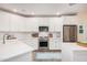Charming kitchen with stainless steel appliances, white cabinets, and ample counter space at 2511 W Queen Creek Rd # 163, Chandler, AZ 85248