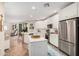 Open-concept kitchen features stainless steel appliances and seamless flow to living area at 2511 W Queen Creek Rd # 163, Chandler, AZ 85248