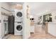 Functional laundry area with stacked washer and dryer and easy access to the living space at 2511 W Queen Creek Rd # 163, Chandler, AZ 85248