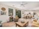 Open living space flows into the kitchen with comfortable seating and bright, natural light at 2511 W Queen Creek Rd # 163, Chandler, AZ 85248
