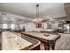 Spacious recreation room featuring a shuffleboard table and a billiards table, plus an island with seating at 2511 W Queen Creek Rd # 163, Chandler, AZ 85248