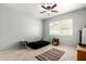 Cozy bedroom featuring a ceiling fan and a bright window for natural light at 2701 E Lockwood St, Mesa, AZ 85213