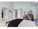 Bright bedroom featuring a neutral color palette and organized shelving for a clutter-free space at 2701 E Lockwood St, Mesa, AZ 85213