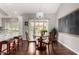 Charming dining area with a round table, wooden chairs, and natural light at 2701 E Lockwood St, Mesa, AZ 85213