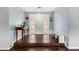 Inviting entryway with hardwood floors, a console table, and a bench for convenient shoe storage at 2701 E Lockwood St, Mesa, AZ 85213