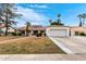 Lovely home with an expansive front yard and a charming brick walkway leading to the front door at 2701 E Lockwood St, Mesa, AZ 85213