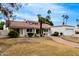Charming single-story home with a red tile roof and well-manicured landscaping at 2701 E Lockwood St, Mesa, AZ 85213