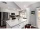 Beautiful kitchen with stainless appliances, white cabinets, and a large island with quartz countertops at 2701 E Lockwood St, Mesa, AZ 85213