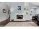 Comfortable living room with a marble fireplace, light blue walls, and dark wood-like flooring at 2701 E Lockwood St, Mesa, AZ 85213