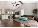 Open floor plan with vaulted ceilings, hardwood floors, and large windows offering ample natural light at 2701 E Lockwood St, Mesa, AZ 85213