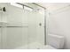 Modern shower with glass door, shelving, and fixtures at 2701 E Lockwood St, Mesa, AZ 85213