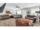 Bright living room featuring neutral tones, plush seating, and wood-look flooring at 2744 E John Cabot Rd, Phoenix, AZ 85032