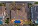 Stunning aerial view of home showcasing tile roof, private pool, putting green, and meticulously landscaped backyard at 2998 E Waterman Way, Gilbert, AZ 85297