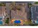 Aerial view of a home showcasing a backyard oasis with a pool, spa, and putting green at 2998 E Waterman Way, Gilbert, AZ 85297