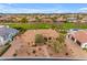 An aerial shot of the home showcasing its manicured landscaping, and tile roof at 2998 E Waterman Way, Gilbert, AZ 85297