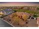 Overhead shot of desert house with decorative landscaping, trees and desert accents at 2998 E Waterman Way, Gilbert, AZ 85297