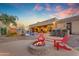 Outdoor living area with a pool, fire pit, and seating, perfect for relaxation and entertainment at 2998 E Waterman Way, Gilbert, AZ 85297