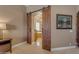 Open barn doors to the ensuite bathroom reveals a soaking tub at 2998 E Waterman Way, Gilbert, AZ 85297