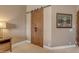 Attractive barn doors lead to the primary ensuite bathroom at 2998 E Waterman Way, Gilbert, AZ 85297
