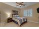 This bedroom features a ceiling fan and a window with plantation shutters, adding elegance at 2998 E Waterman Way, Gilbert, AZ 85297